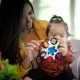 Jucarie senzoriala Curiosity Clutch Twist & Pop Rattle Teether Baby Einstein