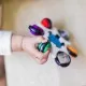 Jucarie senzoriala Curiosity Clutch Twist & Pop Rattle Teether Baby Einstein