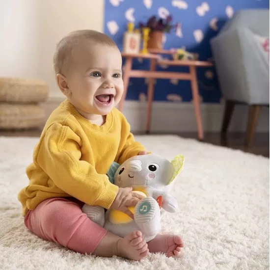 Jucarie interactiva Hug a Bye Baby Elephant Bright Starts