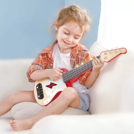 Jucarie din lemn - Instrument Ukulele (chitara) rosu Jucarie din lemn - Instrument Ukulele (chitara) rosu